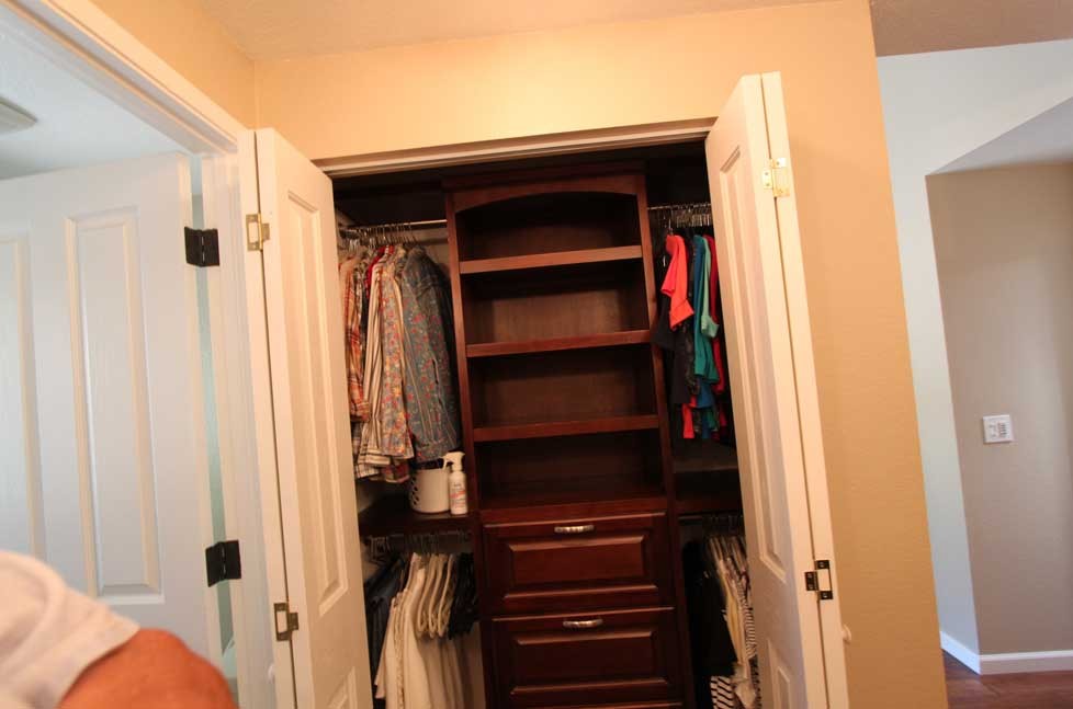 The laundry closet is easily hidden behind two large doors when not in use