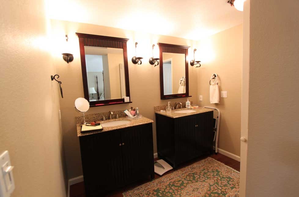 The vanity is topped with easy to maintain quartz