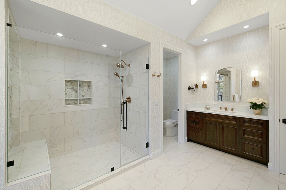 the oversize shower includes a shower niche and bench