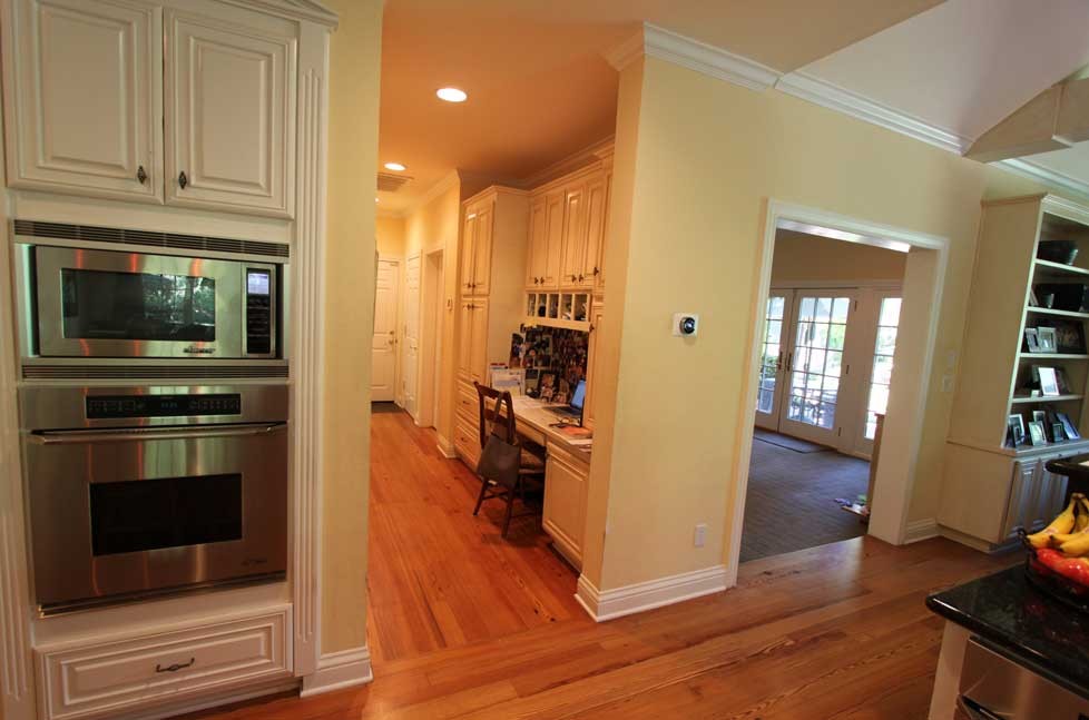 After Remodel: a built-in custom work station with open shelving and a custom printer cabinet