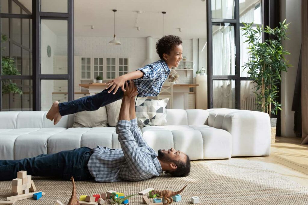 Dad and son in living room