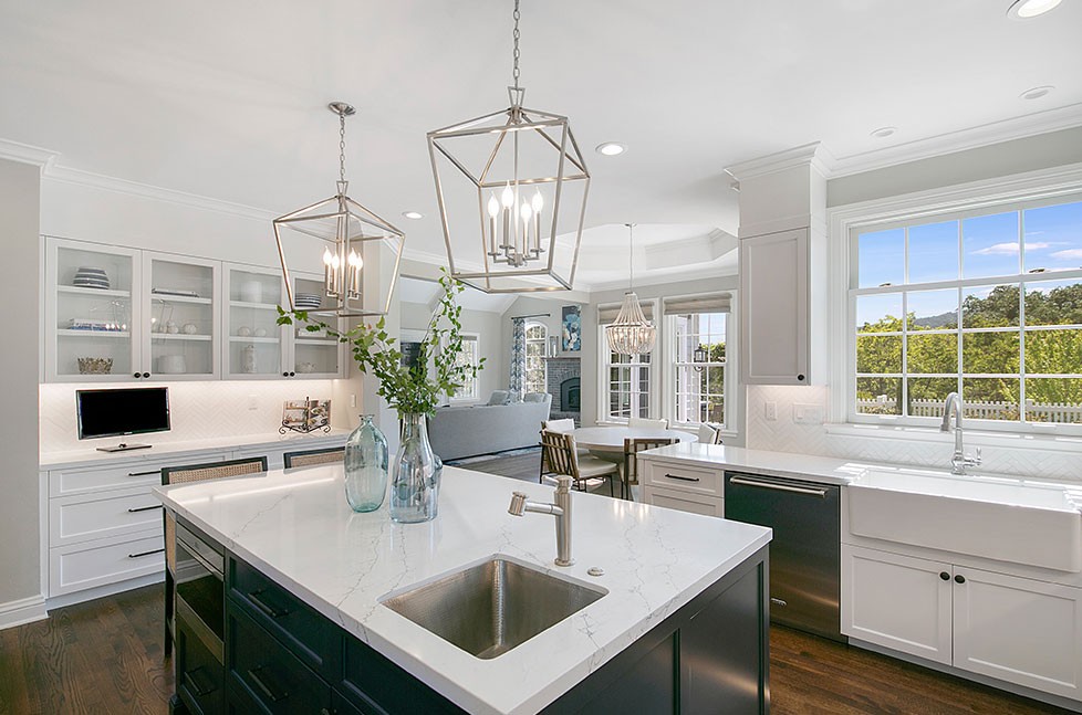 an older white traditional kitchen was transformed into a transitional style modern masterpiece