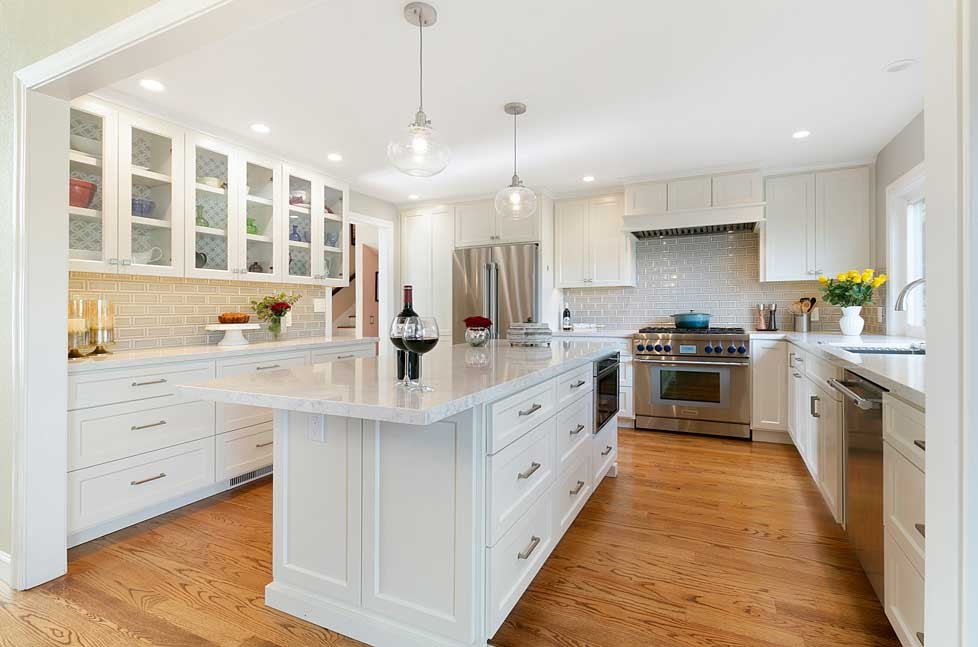 Seedy glass pendant lights in a brushed nickel finish add a fun design element to the space