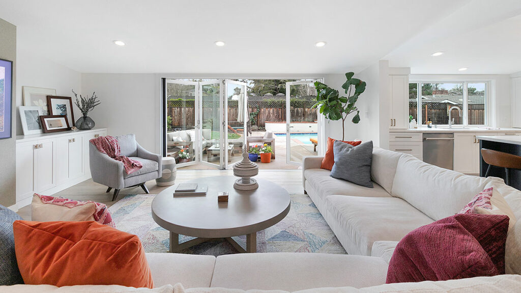 great room remodel with a large multi-paneled sliding glass door to backyard