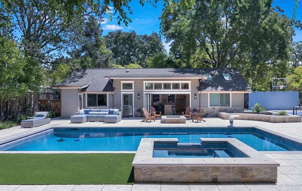 a beautiful home with a huge pool